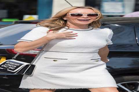 Amanda Holden flashes her tanned legs in white minidress as she arrives for radio show