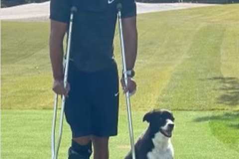 Golf legend Tiger Woods posts pic in leg brace with his dog on road to recovery after horror car..