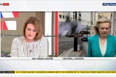 Moment Trade Secretary Liz Truss almost hit on head by falling tripod during live Sky TV interview