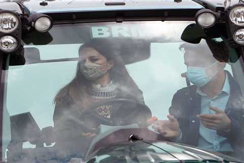 Kate Middleton and Prince William get their hands dirty as they pet sheep and drive TRACTOR on farm ..