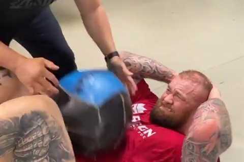 Watch as Game of Thrones star Hafthor Bjornsson has exercise ball thrown at body to toughen up for..