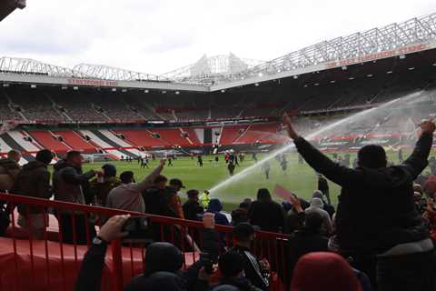 Angry Man Utd fans break into Old Trafford and storm onto pitch in huge security breach in protest..