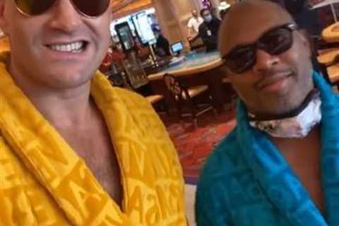 Tyson Fury and coach brilliantly hit back at Eddie Hearn as they wear Versace dressing gowns in..