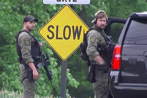 An armed man was wounded in an exchange with an F.B.I. agent outside the C.I.A.’s headquarters in..