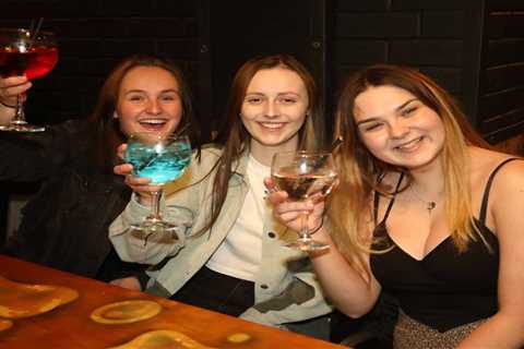 Drinkers sink pints inside pubs at the stroke of midnight as indoor mixing allowed for the first..
