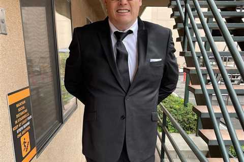The Chase star Mark Labbett shows off ten stone weight loss in James Bond style suit