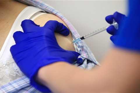 Employers can require workers to get Covid vaccine and offer rewards, Biden administration announces
