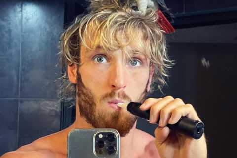 Logan Paul brushes teeth with pet parrot Sir perched on his head ahead of Floyd Mayweather fight