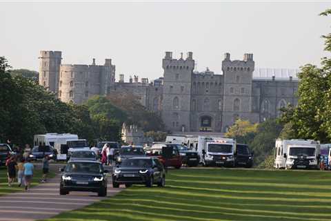 Prince Andrew drives past travellers who set up caravan camp outside Windsor