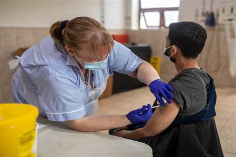Covid vaccines have ‘broken the chain’ between catching bug and becoming ill, NHS expert says with..