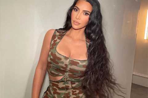 Kim Kardashian stuns in camouflage jumpsuit after admitting to making 2002 sex tape with Ray J..