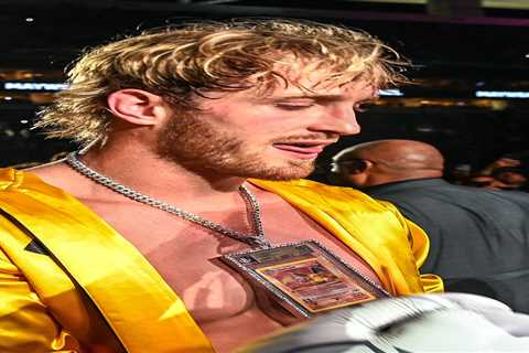 Logan Paul walks to the ring wearing £100,000 Pokemon card on his chest as Floyd Mayweather dons..