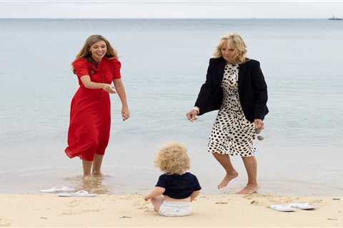 Carrie Symonds plays with son Wilfred as she joins Jill Biden on beach walk