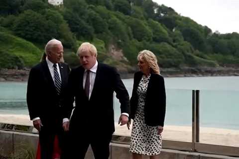 Awkward moment Boris Johnson almost holds hands with Joe Biden’s wife Jill as new wife Carrie..