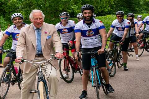 Prince Charles grins as he hops on a bike after Harry’s claims he never went on rides with his dad