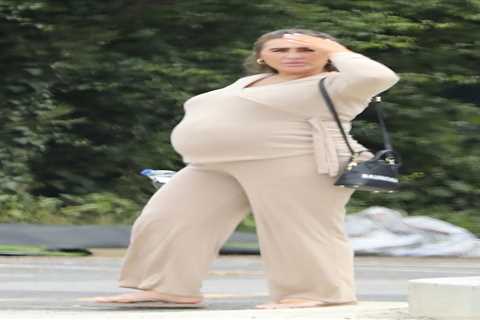 Lauren Goodger showcases her baby bump in form-fitting loungewear