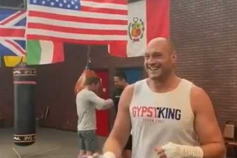 Watch Tyson Fury sing ‘It’s coming home’ and gather round phone by ring in training to see England..