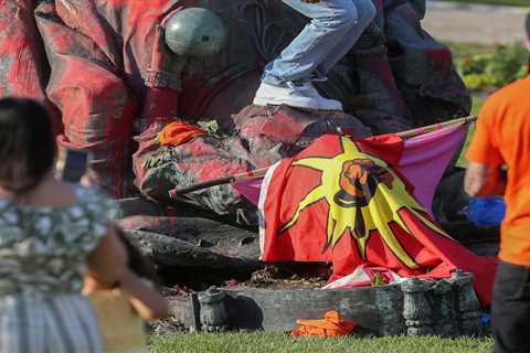 Statue of The Queen is TOPPLED by protesters in Canada over deaths of 1,000 Indigenous children..