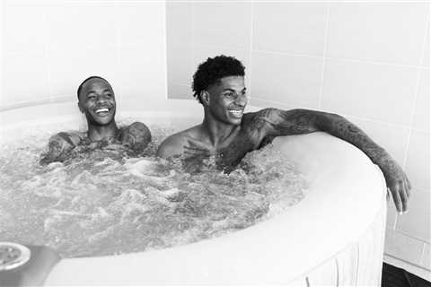 Footie aces Sterling and Rashford relaxed in a hot tub ahead of Wednesday’s semi clash with Denmark