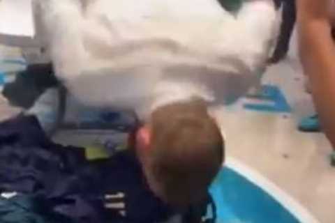 Watch Italy legend Daniele De Rossi slide over beer-soaked table in dressing-room celebrations..