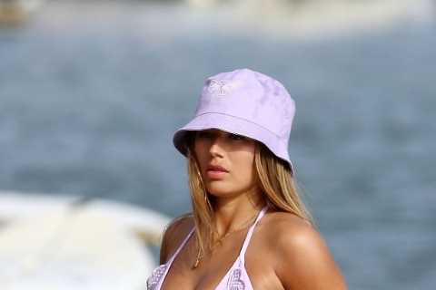 Arabella Chi wows in lilac bikini with matching hat as she takes a dip in Med