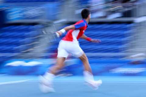 Watch Djokovic throw racket into STANDS then smash it against net in huge meltdown during shock..