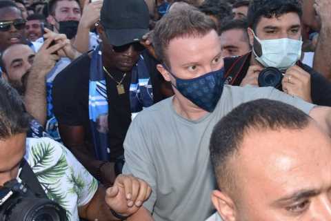 Mario Balotelli is swarmed by hundreds of fans after landing in Turkey following Adana Demirspor..