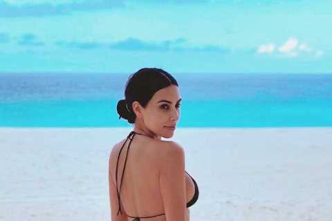 Kim Kardashian shares photo of her bare butt in a thong bikini and jokes she has ‘resting beach..