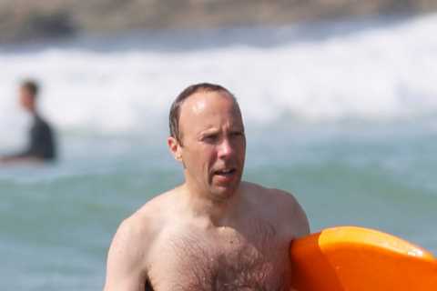 Washed-up Matt Hancock makes a splash with a bodyboard on seaside holiday with his kids and..