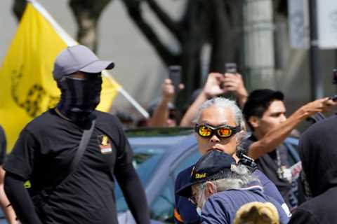 Man stabbed as hundreds of anti-vaccine protesters and Antifa brawl outside Los Angeles City Hall