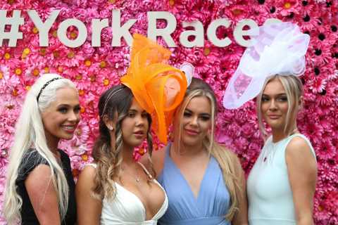 Stunning punters brave damp weather and wear glam frocks to York’s Ebor Festival as racegoers enjoy ..