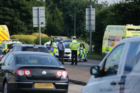 Girl, 4, flung from moving car on busy road in front of horrified motorists who battle to save her