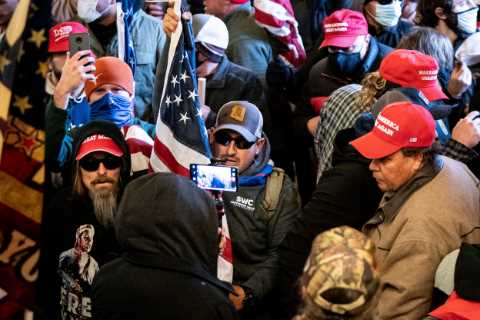 Capitol Police formally clear officer who shot rioter, saying he may have saved lives.