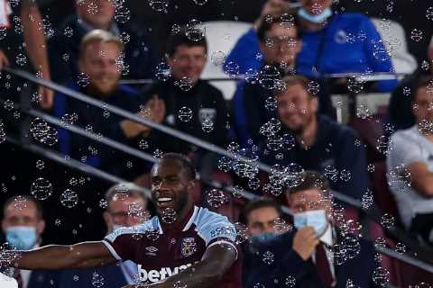 Michail Antonio celebrates becoming West Ham’s top Premier League scorer ever with cardboard..