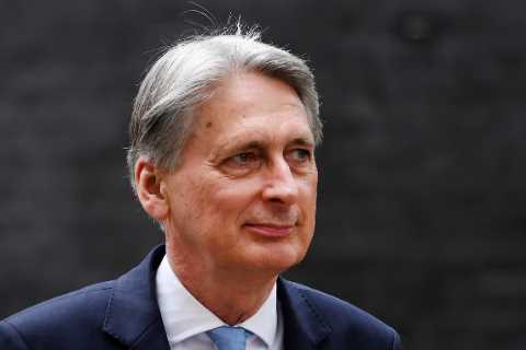 Former Chancellor Philip Hammond rapped by watchdog for using government links to aid bank he now..