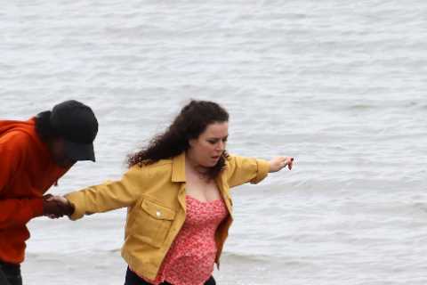 Pregnant Tracy Beaker star Dani Harmer shows baby bump as she wades into the sea filming CBBC..