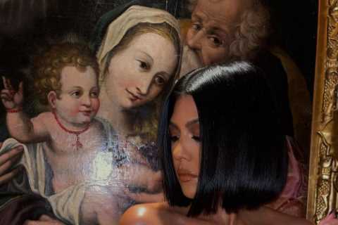 Kourtney Kardashian busts out of red see-through corset in jaw-dropping new photo after shading..