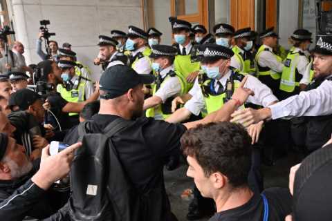 Anti-vaccine mob clashes with cops as they try to storm medicine watchdog building over jabs