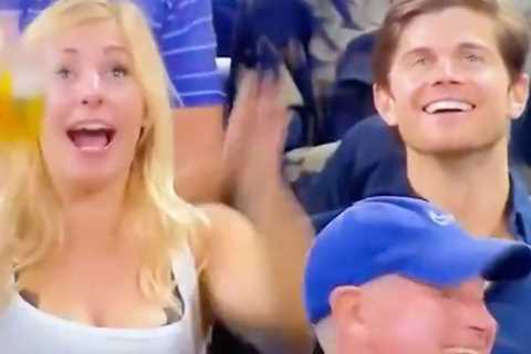 US Open fan goes viral for chugging cup of beer after seeing herself on big screen as tennis fans..