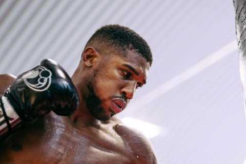 Anthony Joshua shows off new lean physique but biceps still bulging after weight cut before..