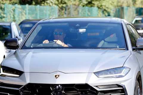 Cristiano Ronaldo chased by adoring Man Utd fans as he leaves training session in £160,000..