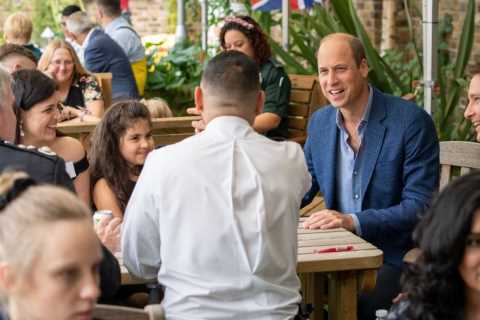 Prince William grins as he meets firefighters in first engagement back after summer break