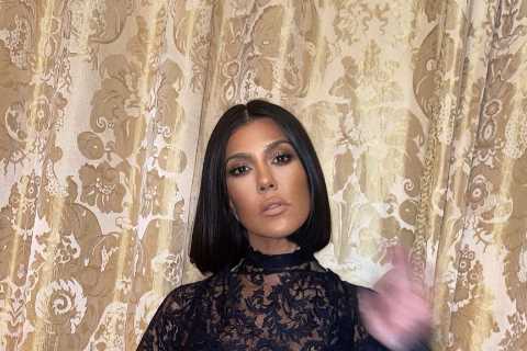 Kourtney Kardashian stuns in a sheer lace dress as fans beg her to ‘get pregnant now’ with Travis..