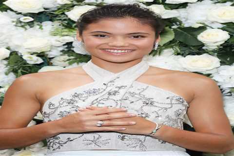 Emma Raducanu, 18, beams in elegant white crop top and skirt at London Fashion Week after making..