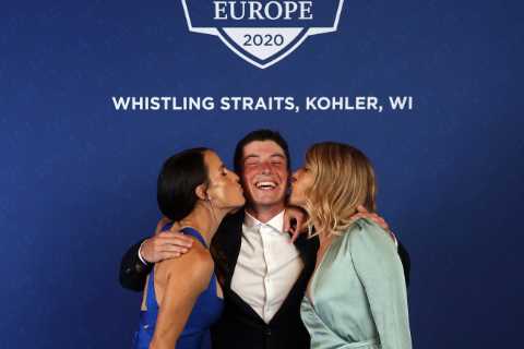 Single Ryder Cup star Viktor Hovland beams as he is kissed by team-mates’ Wags at Team Europe Gala..