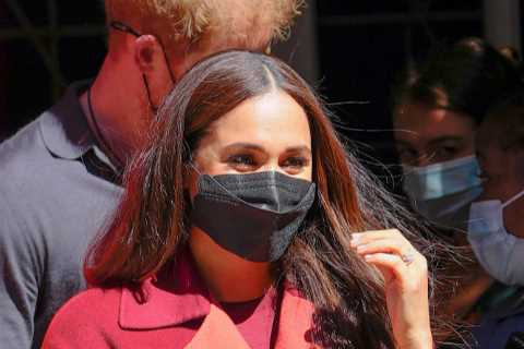 Meghan arrives at school where 94% get free meals, with the duchess wearing £5.5K designer suit