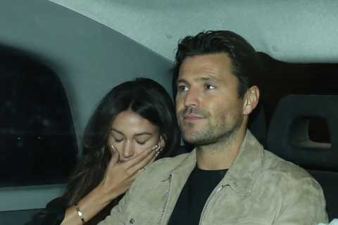 Michelle Keegan and Mark Wright put on rare public display of affection as they cuddle after date..