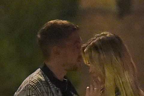 Emily Atack cuddles up to a friend on boozy night out in Camden