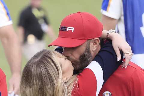 Dustin Johnson kisses stunning fiancee Paulina Gretzky after former World No1 beats Paul Casey in..