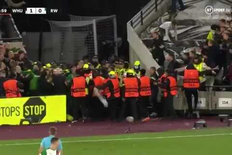 West Ham and Rapid Vienna fans throw URINE at each other as visiting supporters storm home end..